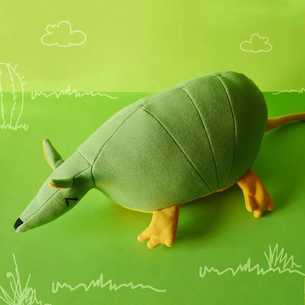 Muñeco Tatú carreta verde