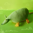 Muñeco Tatú carreta verde