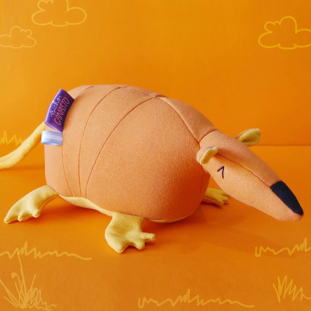 Muñeco Tatú carreta naranja